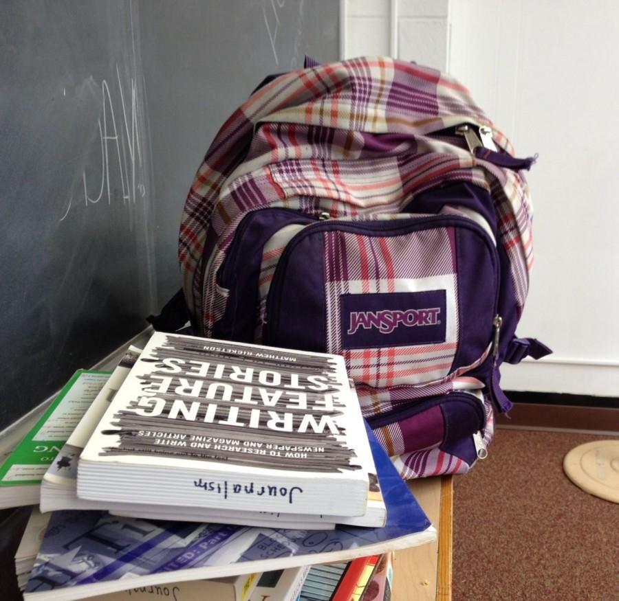 A plethora of books from a students backpack