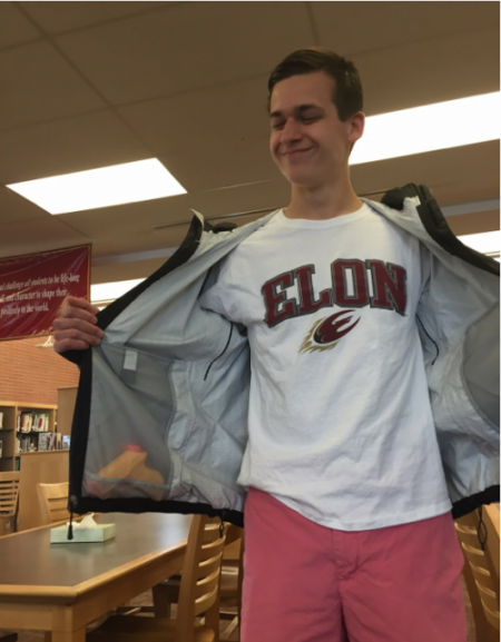 Student Will Henderson hides his watergun in a North Face windbreaker