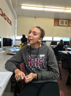 Pictured above, senior Loryn Camp got into the spirit and dressed like Coach Rosella for Dress Like a Teacher day.