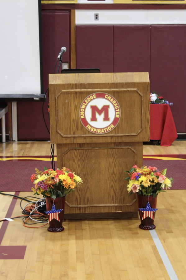 MHS+podium+decorated+for+Veterans+Day+assembly
