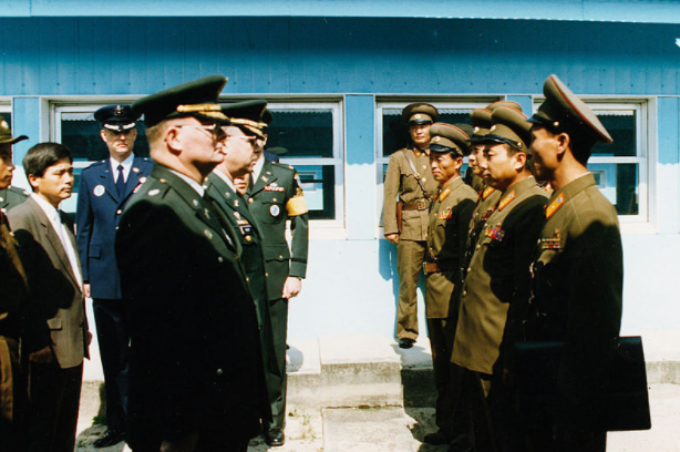 Soldiers from North and South Korea greet each other