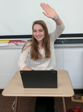 Natalie Azzolini actively participates in a class discussion.