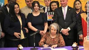 New Mexico Governor Michelle Lujan Grisham signing SB 140 into law