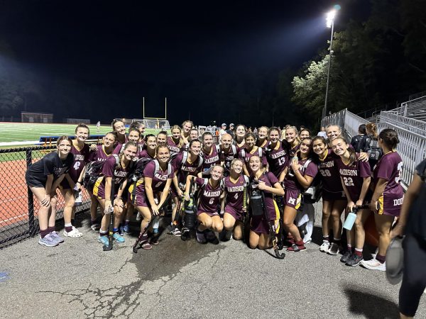 The girl field hockey team at there away game against mountain lakes after their win 5-0