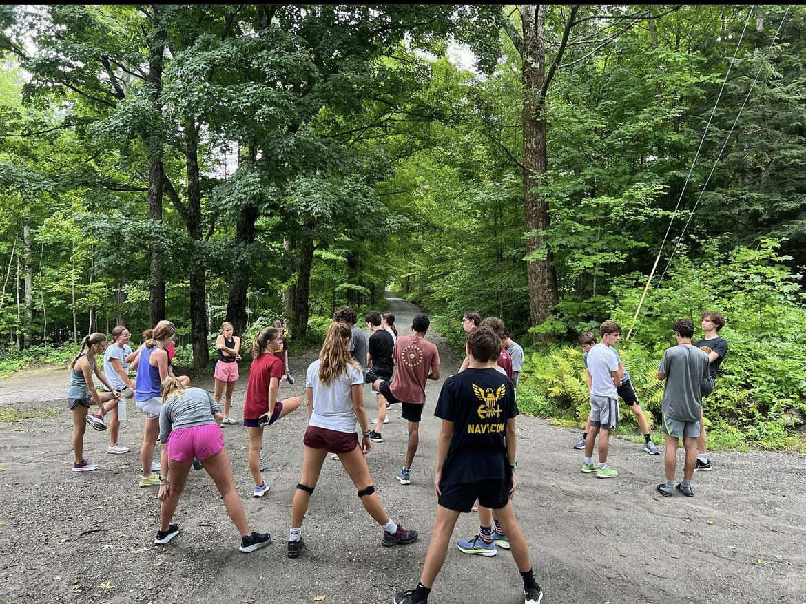 The Cross Country team stretching for a big run on their Vermont trip.