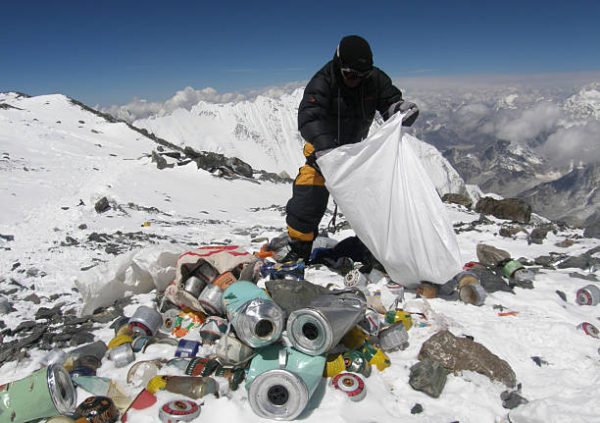 This picture taken on May 23, 2010 shows a Nepalese sherpa collecting garbage, left by climbers, at an altitude of 8,000 metres during the Everest clean-up expedition at Mount Everest.