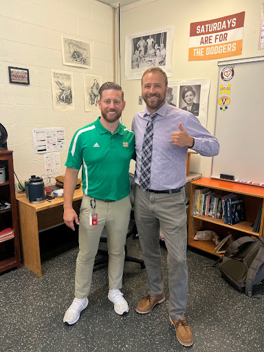 Standing happily together is Coach Rogers on the left and Coach Murphy on the right.