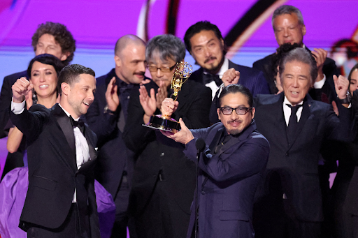 Hiroyuki Sanada holding up the Emmy Award for winning Best Drama with Shogun, via. Reuters