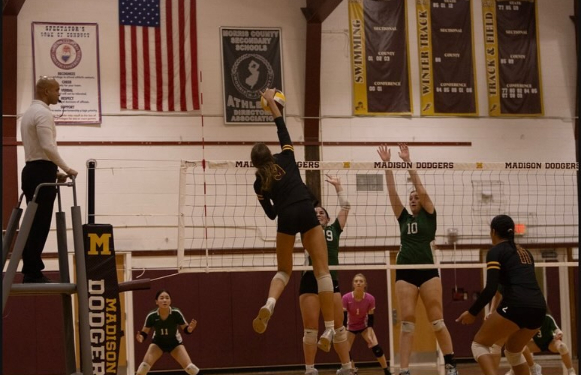 Captain, Sophia Christoffers, spiking the ball